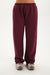 Maroon sweatpants worn by a person on a white background <model-info>Bre wears a size M and is 5’7”, 25½" waist, 33” bust.</model-info>