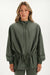 Woman wearing a green jacket on a white background <model-info>Bre wears a size S and is 5’7”, 25½" waist, 33” bust.</model-info>