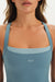 Blue sports bra with 'SET' logo on a neutral background
