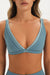 Blue sports bra with 'SET' branding on a neutral background