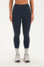 Woman wearing a navy leggings on a white background <model-info>Bre wears a size M and is 5’7”, 25½" waist, 33” bust.</model-info>