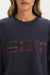 Navy sweatshirt with plaid 'SET' logo worn by a person