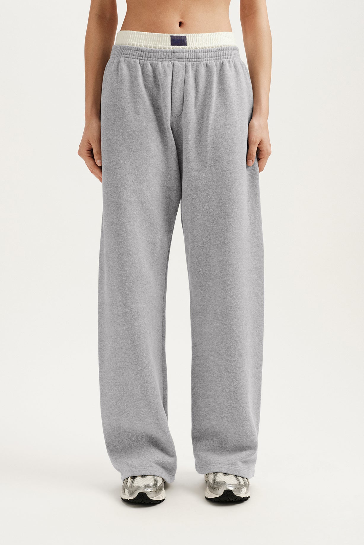 Gray sweatpants worn by a person on a white background <model-info>Maranda wears a size S and is 5’10”, 24½” waist, 33” bust.</model-info>