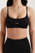Black sports bra with 'SET' branding on a plain background