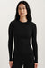 Woman wearing a black long-sleeve top against a plain background <model-info>Jasmine wears a size XS and is 5’8, 25” waist, 32C bust.</model-info> 