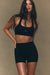 Woman wearing a black sports bra and shorts set against a beige background <model-info>Jelene wears a size XS and is 5’7”, 23” waist, 32AB bust.</model-info>