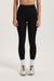 Person wearing black leggings on a white background <model-info>Brinley wears a size XS and is 5’8, 23” waist, 32A bust.</model-info> 