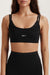 Black sports bra with 'SET' branding on a white background