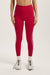 Woman wearing red leggings on a light gray background <model-info>Jocelyn wears a size S and is 5’9, 23” waist, 32B bust.</model-info> 