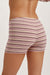 Striped shorts worn by a person on a plain background