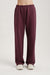Maroon sweatpants on a plain background