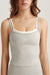 Gray tank top with white straps worn by a person on a light background