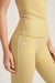 Yellow leggings with a visible brand logo on a light background