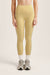 Woman wearing yellow leggings on a light beige background <model-info>Bella wears a size XS and is 5’7, 23” waist, 32AB bust.</model-info>