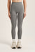 Gray leggings worn by a person on a light pink background <model-info>Bella wears a size XS and is 5’7, 23” waist, 32AB bust.</model-info>
