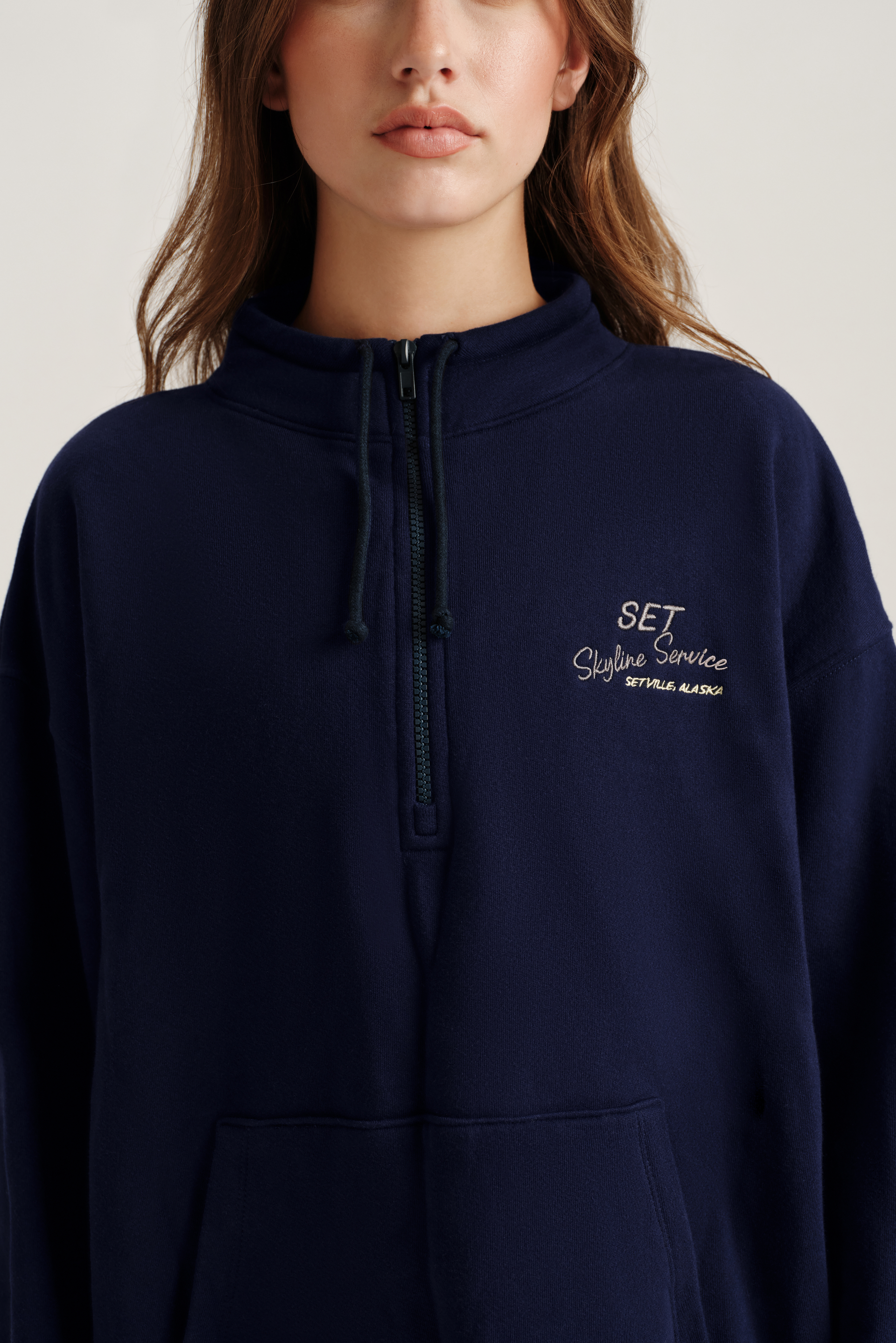 Navy blue hoodie with 'SET' logo on a plain background