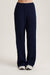 Navy blue pants on a white background <model-info>Kalia wears a size S and is 5’9, 23” waist, 32B bust.</model-info> 