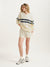 Woman wearing a cream-colored sweatshirt with navy stripes and shorts on a white background <model-info>Alyssa wears a size S and is 5’9, 23” waist, 32B bust.</model-info>