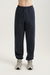Navy sweatpants worn by a person on a white background<model-info>Alyssa wears a size S and is 5’9, 23” waist, 32B bust.</model-info>