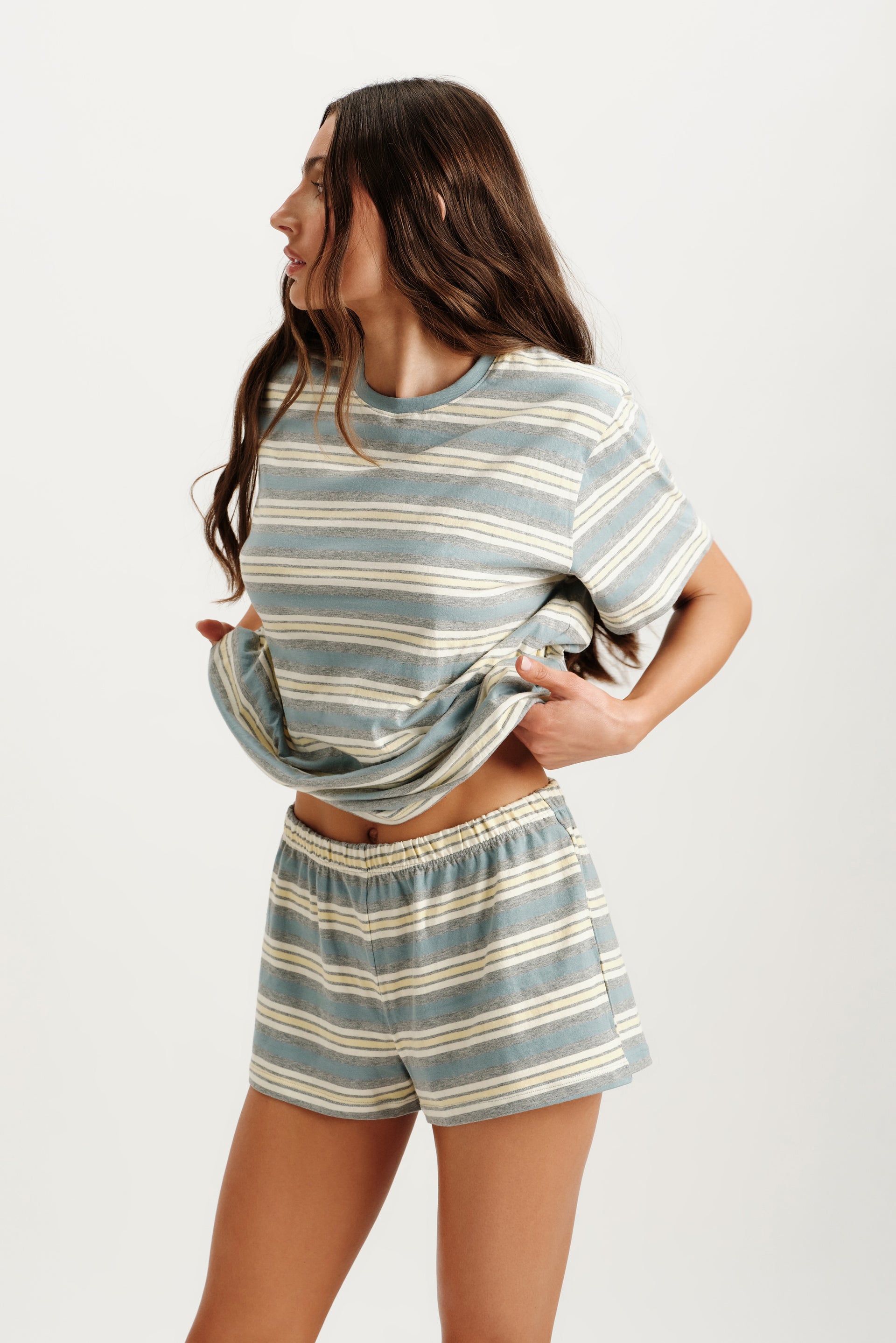 Woman wearing a striped outfit on a white background <model-info>Logan wears a size S and is 5’9½”, 24” waist, 32B bust.</model-info>