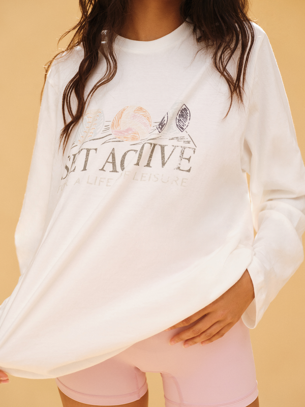 White sweatshirt with 'SET Active' text and graphics on a beige background