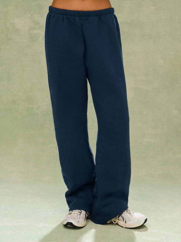 Navy blue sweatpants on a plain background 