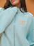 Light blue jacket with 'SET' logo on a plain background