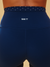 Navy blue athletic shorts with 'SET' logo on a beige background