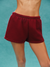 Maroon shorts worn by a person on a teal background <model-info>Allie wears a size S and is 5’7½, 25” waist, 32B bust.</model-info> 