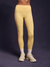 Yellow leggings worn by a person on a dark background
