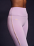 Light purple leggings with yellow piping on a dark background
