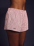 Woman wearing a pink athletic shorts. <model-info>Umi wears a size S and is 5’8½”, 23½” waist, 32B bust.</model-info>