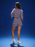 Person wearing a red and white striped outfit on a blue background