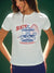 Woman wearing a white t-shirt with a State Fair graphic design. <model-info>Logan wears a size S and is 5’9½”, 24” waist, 32B bust.</model-info>