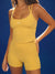 Yellow athletic outfit with 'SET' branding on a blue background