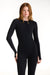 Woman wearing a black long-sleeve bodysuit on a white background