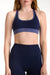 Navy sports bra and leggings set on a white background