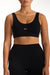 Black sports bra with 'SET' logo worn by a person on a white background