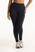 Person wearing black leggings on a white background <model-info>Jade wears a size L and is 5’9”, 30” waist, 38” bust.</model-info>