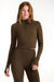 Woman wearing a brown long-sleeve top and leggings on a white background <model-info>Dickey wears a size S and is 5’9”, 24” waist, 32” bust.</model-info>