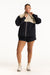 Person wearing a black and beige jacket with shorts on a white background <model-info>Jade wears a size L and is 5’9”, 30” waist, 38” bust.</model-info>