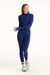 Woman wearing a blue athletic outfit on a white background