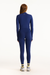Person wearing a blue tracksuit on a white background