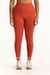 Person wearing red leggings on a white background