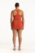 Person wearing an orange outfit on a white background