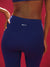 Blue leggings with 'SET' logo on a red background
