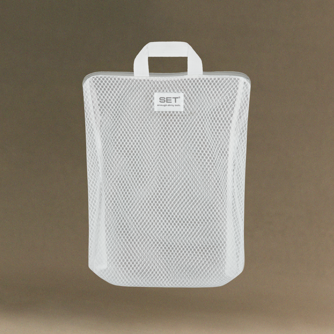 White mesh pouch with handle on a brown background