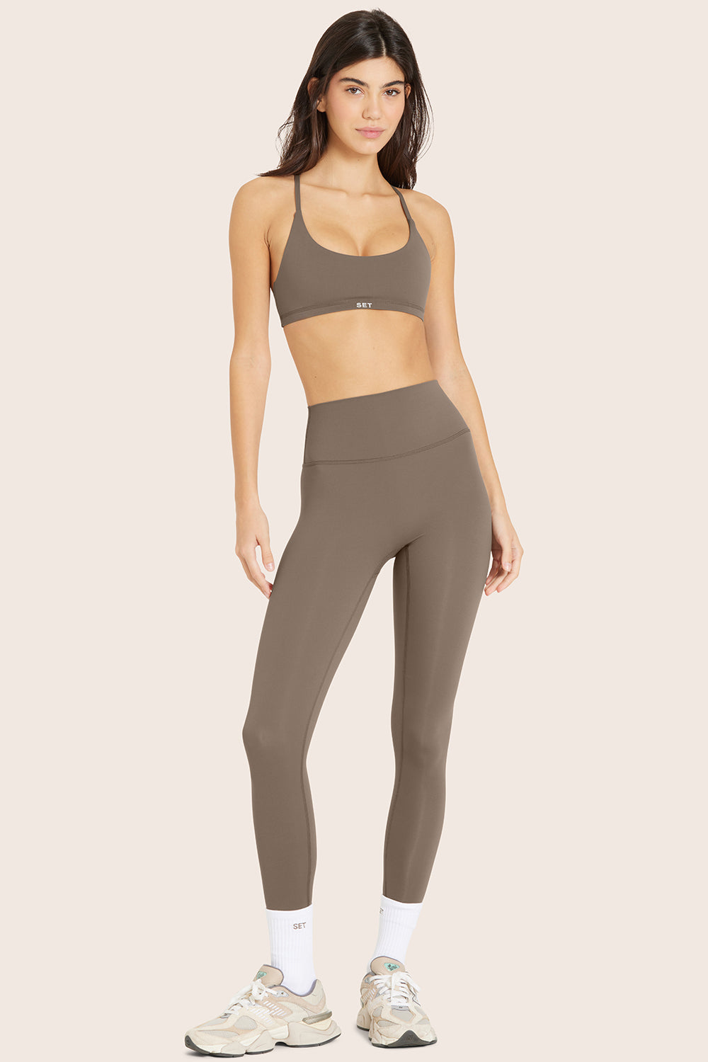 MODEL WEARS AIRLUXE™ BREATHE LEGGINGS IN TRUFFLE