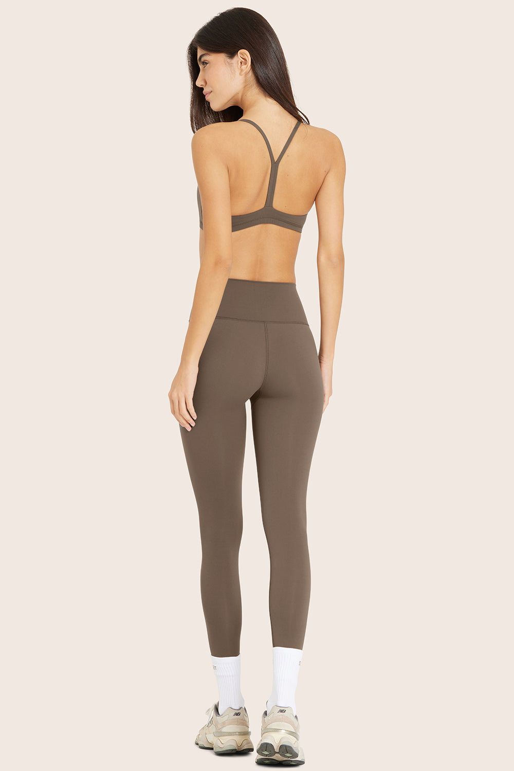 MODEL WEARS AIRLUXE™ BREATHE LEGGINGS IN TRUFFLE