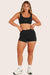 MODEL WEARS BREATHE MINI SHORTS IN ONYX 